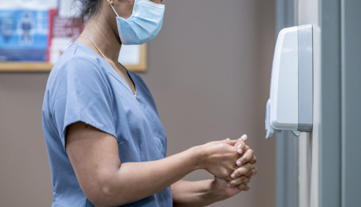 Nurse sanitizes hands